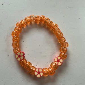 Glitter orange pony bead bracelet with orange flowers
